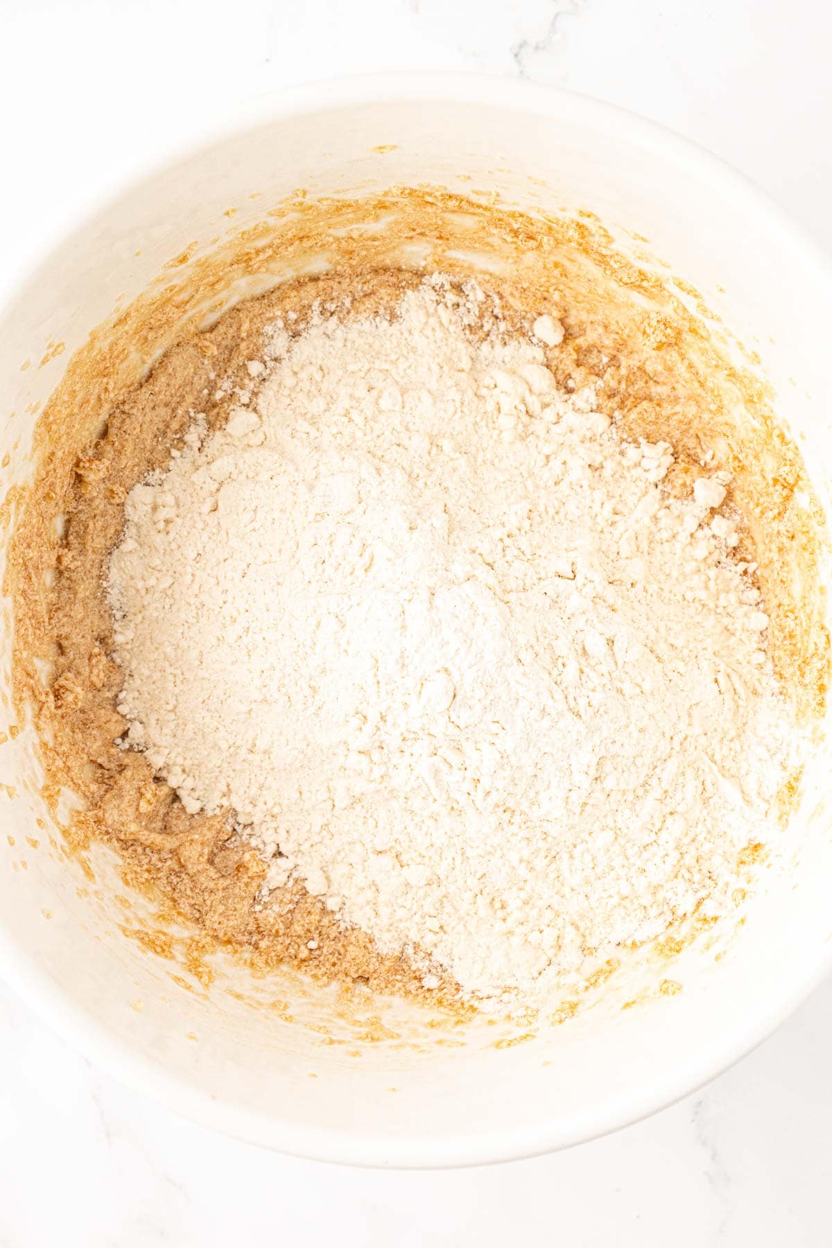 adding the dry ingredients to the wet ingredients